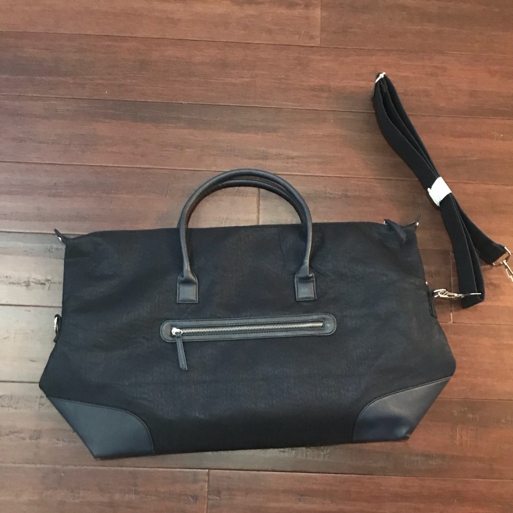 Navy duffle bag with over the shoulder strap
